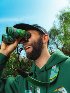 shop nocs x parks project field issue 8x25 waterproof binoculars inspired by national parks | green

a smiling person wearing a green hoodie looks through the binoculars in a wooded setting.

nocs x parks project collab