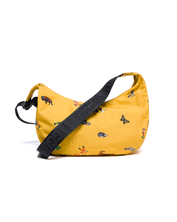Shop Naturalist Club BAGGU Medium Nylon Crescent Bag Inspired by National Parks | mustard